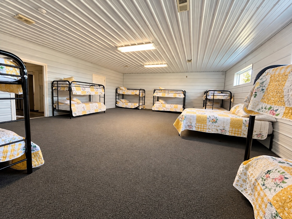 Bunk beds and yellow quilts in a room at The Gathering Place